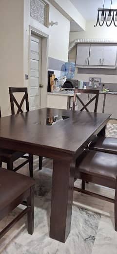 wooden dining table with chairs