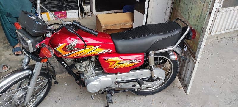 honda 125 with golden number 2