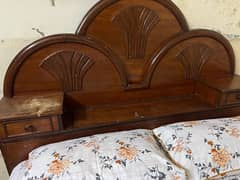 A solid wood double bed