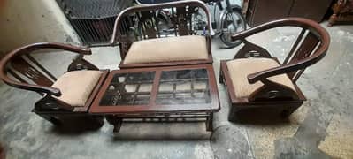 3 wooden sofas with one table