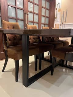 Dark brawn wooden dining table with sofa chairs set