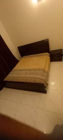 Queen size bed and a dressing table is available for sale