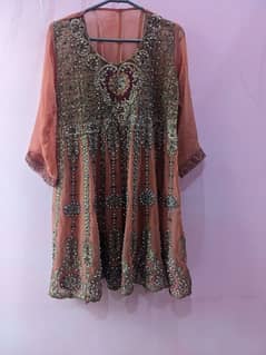 Fully embrodied short frock with sharara and dupatta.