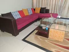 L shaped sofa with center table