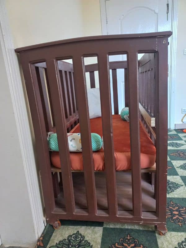 Strong Baby Cot made from Tali wood 1