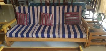 Wooden sofa with movable cushions