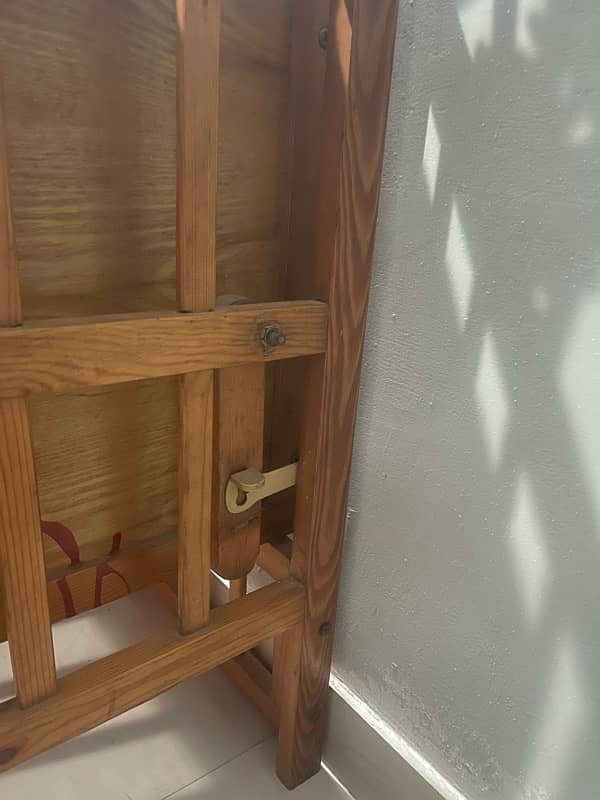 A slightly used swing cot 4