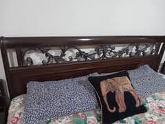 king size wooden double bed with metal work