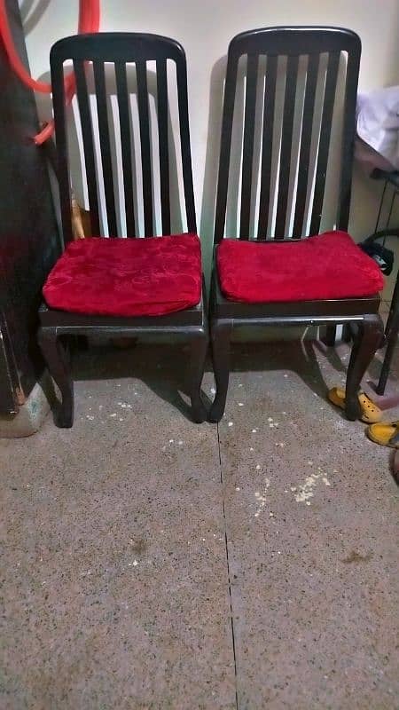 2 wood chairs sale krni h jga ni h. 1