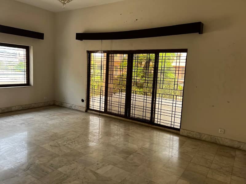 model Town One Kanal House for sale  5 bedroom with attached bathroom double tv lounge double floor double kitchen servent quarter tiles flooring and lush green lown facing park 5