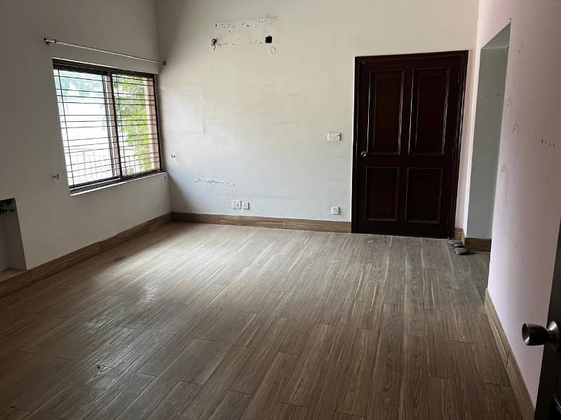 model Town One Kanal House for sale  5 bedroom with attached bathroom double tv lounge double floor double kitchen servent quarter tiles flooring and lush green lown facing park 6