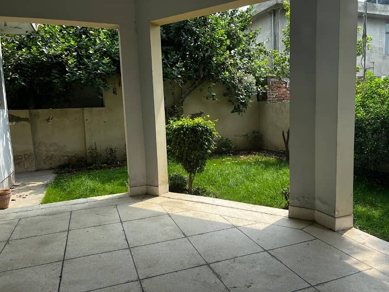 model Town One Kanal House for sale  5 bedroom with attached bathroom double tv lounge double floor double kitchen servent quarter tiles flooring and lush green lown facing park 13