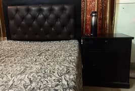 Black decent sing bed with side tables