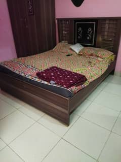 medium size bed with wardrobe and big showcase