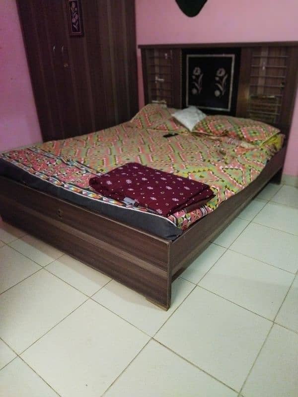 medium size bed with wardrobe and big showcase 0