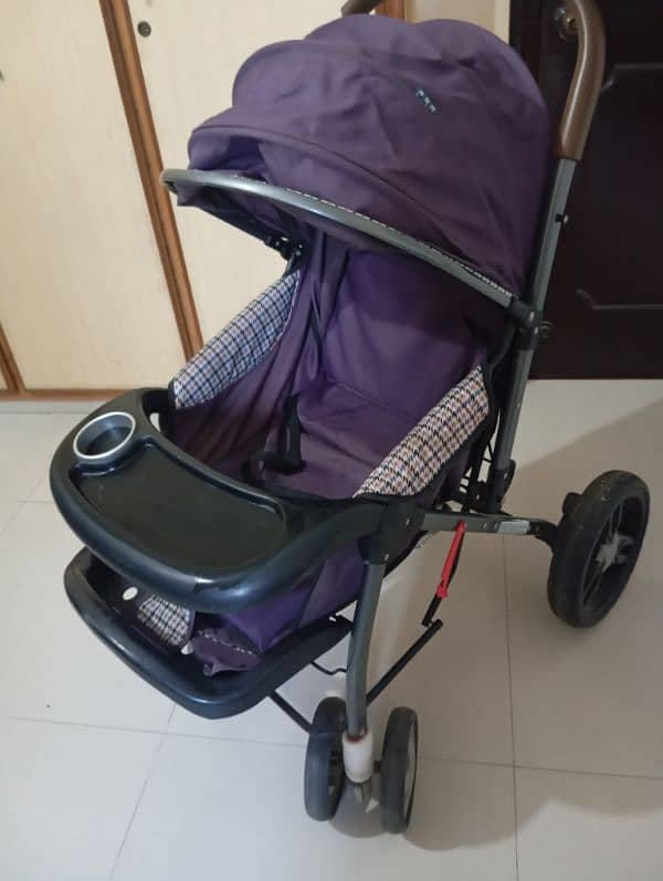 purple colored used pram 1