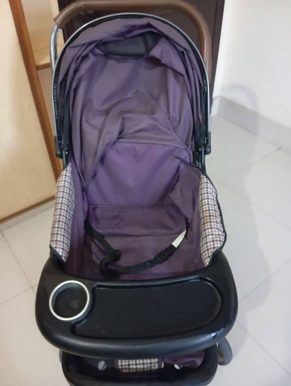 purple colored used pram 2