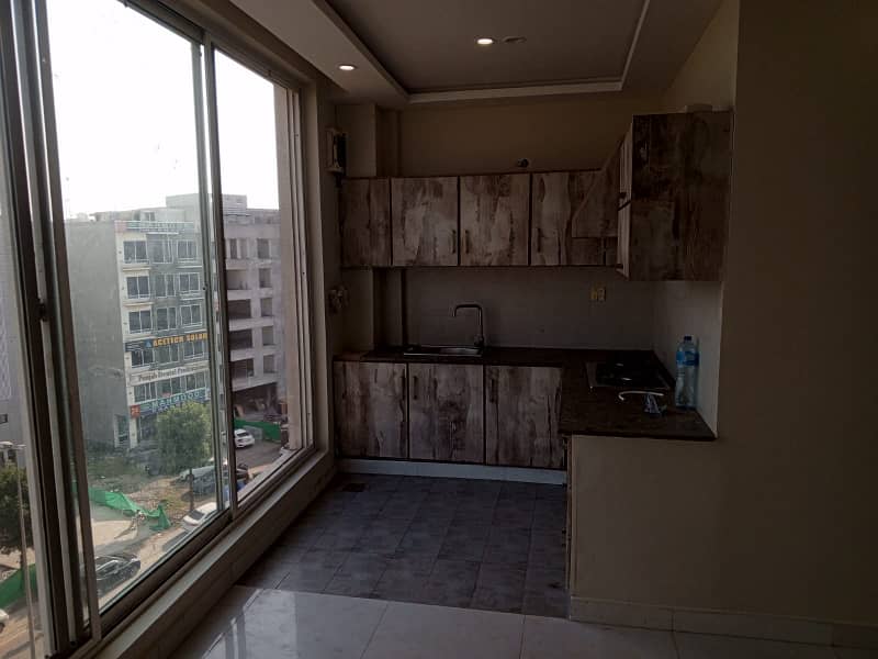 ONE BED APARTMENT AT "C" COMMERCIAL BAHRIA TOWN 24/7 SECURITY, LIFT & ELECTRICITY BACKUP BEST FOR OVERSEAS VISITORS. 5