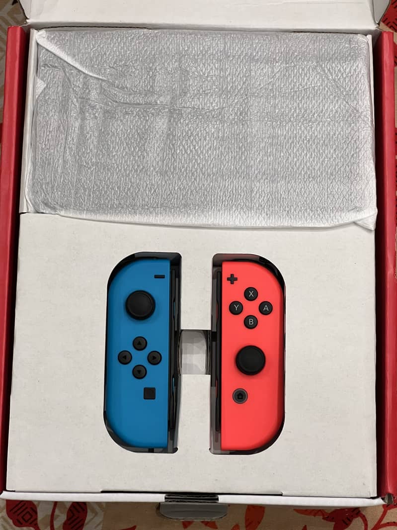 Nintendo Switch OLED Brand new + game 1