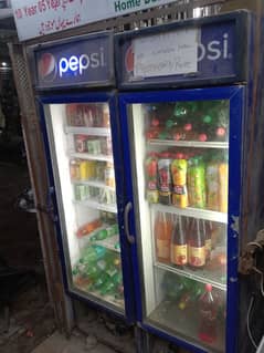 two pepsi fridge with two door frame