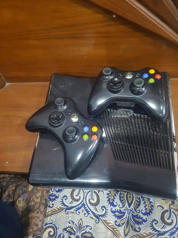 x box 360 slim model and 2 wire less controllers 0