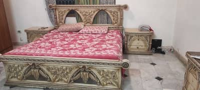 wooden bed with dressing