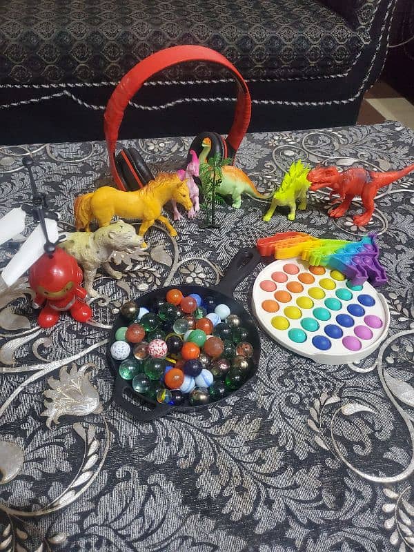 pack of 5 Animals toys,Marbles, headphones, Puppets and 1 iron man 6