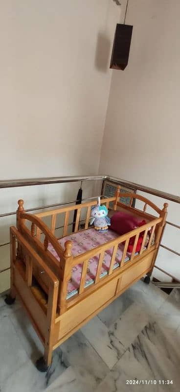 interwood pre loved baby cot/grib 1