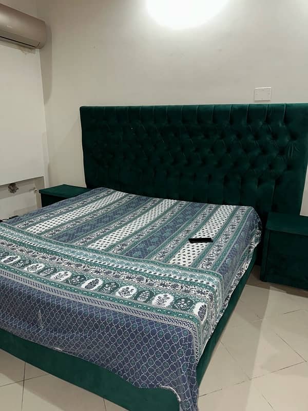 king size bed with side tables and dressing mirror 0