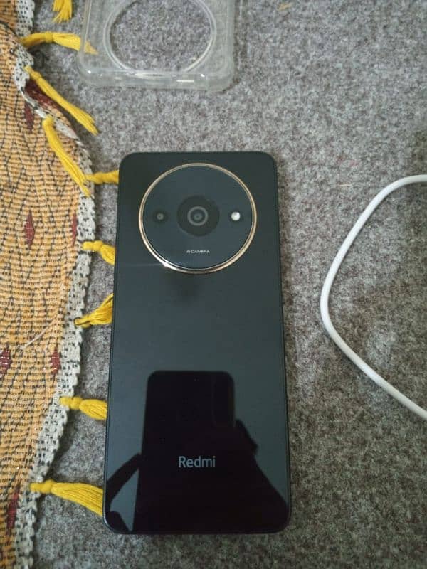 Redmi A3 x with box and charger 1