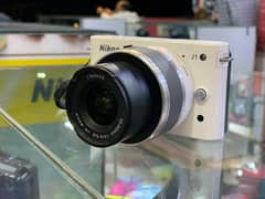 MIRRORLESS CAMERA NIKON J1 WITH 10/30 LENS CONTACT 0321230356