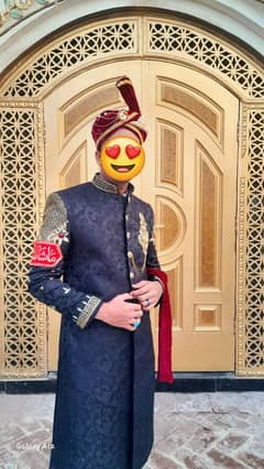 Black sherwani with mendi dress