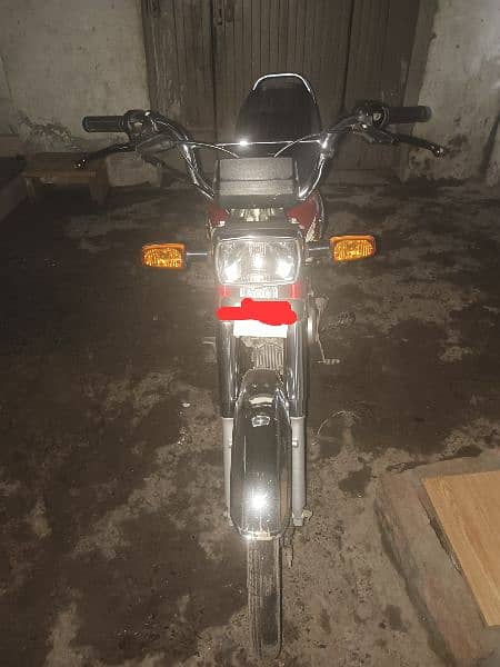 Red Honda CD70 bike. 1