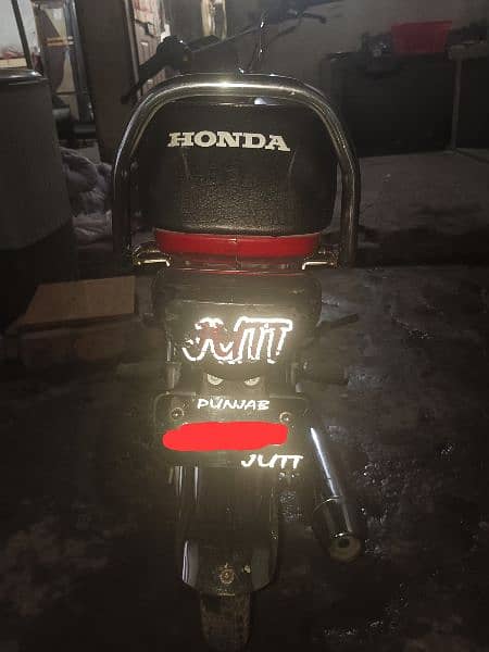 Red Honda CD70 bike. 2