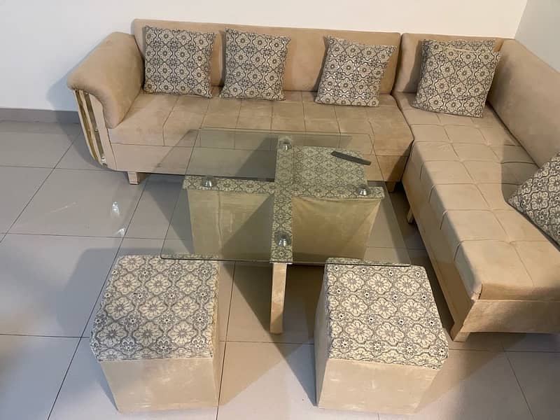 L Shape sofa hardly used Along with table and stools 0