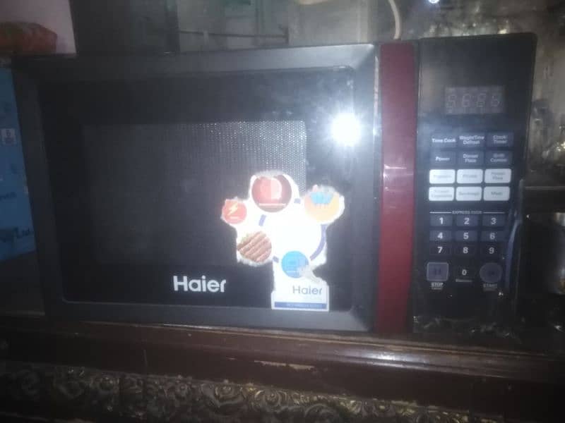 micro oven haier 36100egb bilkol nwo full saizz 0