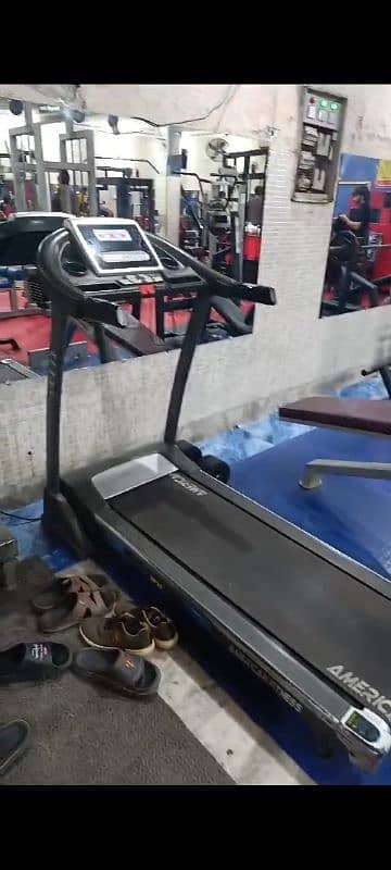 gym equipment treadmill, leg press, leg curl 6