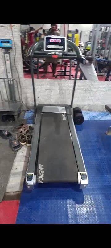 gym equipment treadmill, leg press, leg curl 7