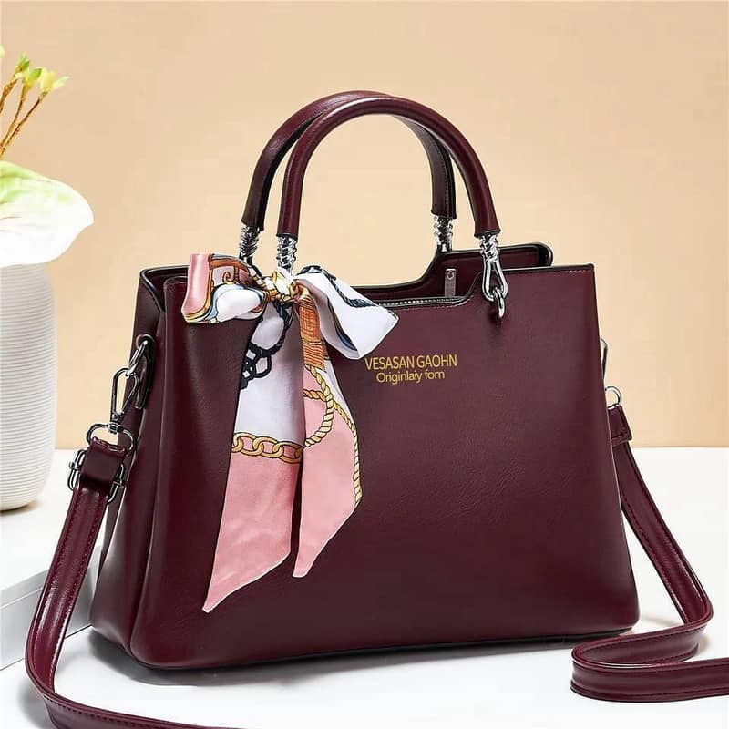 womans leather shoulder bag with long belt 0