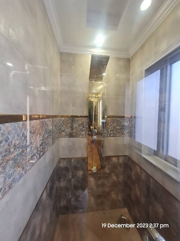 1 Kanal Brand New Super Hot Located Bungalow On Main Road With Full Basement And Home Theatre Is Available For Rent In The Best Block Of DHA Phase 6 Lahore Opposite To Lahore Garrison University 6