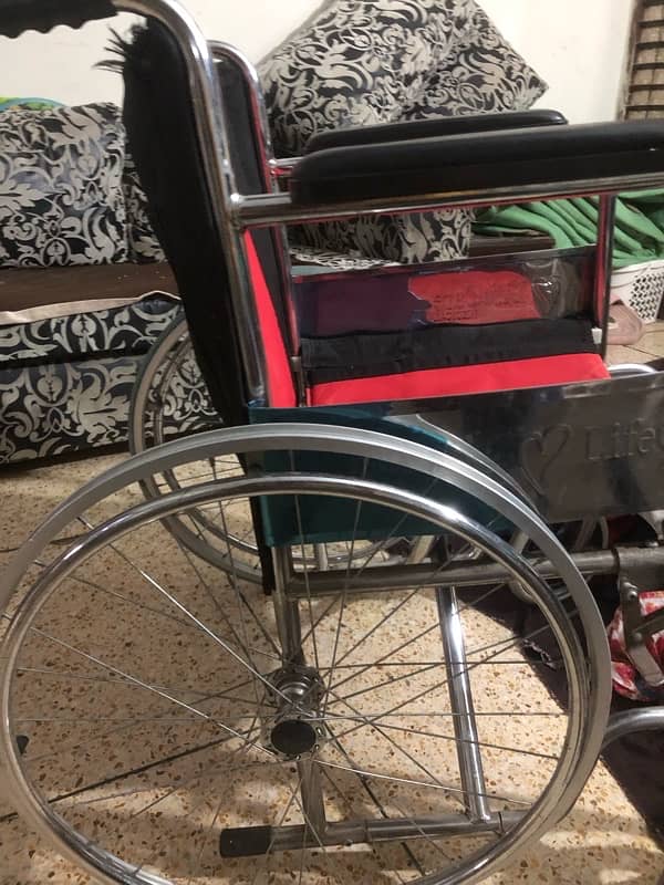 wheel chair new condition 2-3 used only 4