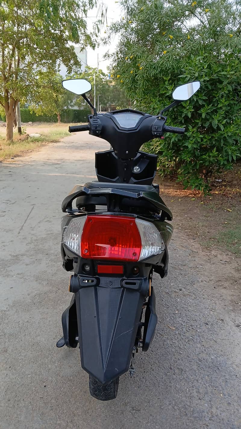 Black electric scooty with brand new batteries 1