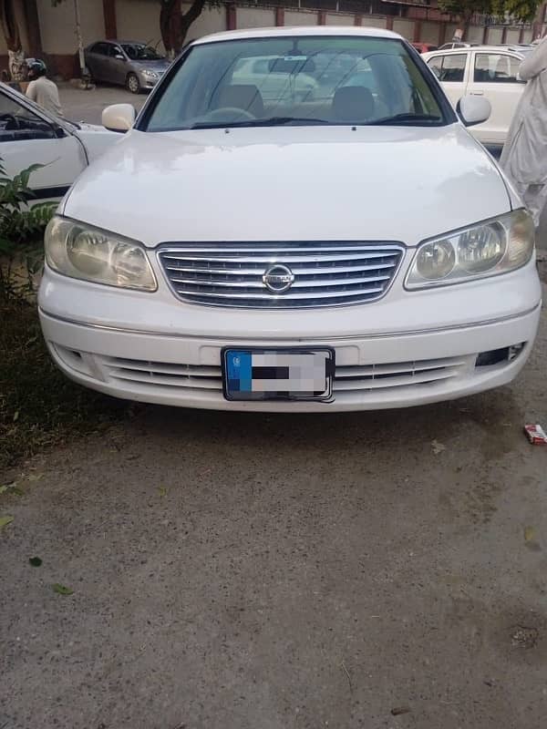 Nissan Sunny 2010 model withe color Islamabad register 0