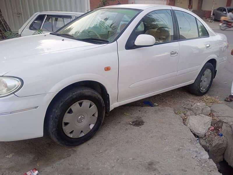 Nissan Sunny 2010 model withe color Islamabad register 2