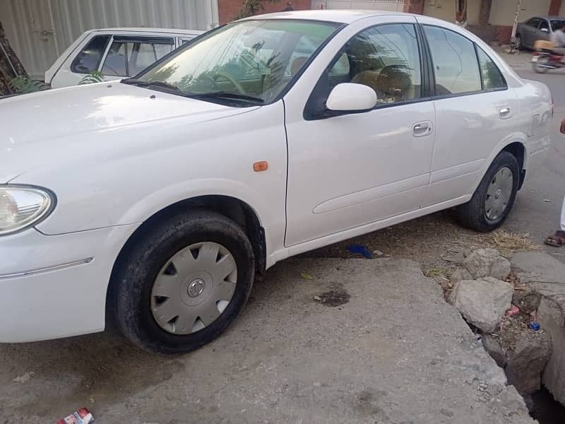 Nissan Sunny 2010 model withe color Islamabad register 4