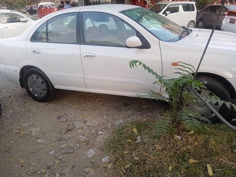 Nissan Sunny 2010 model withe color Islamabad register 5