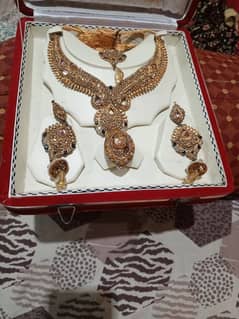 golden copper swt earings neckleace with tikka and ring