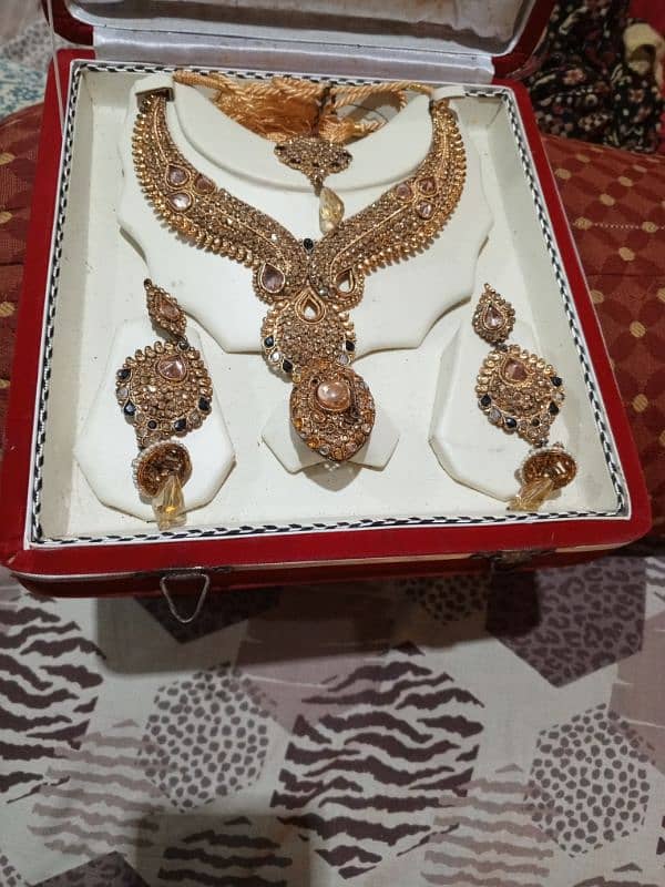 golden copper swt earings neckleace with tikka and ring 0