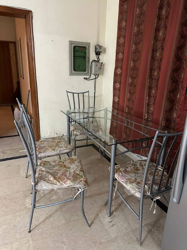 Glass table and 4 metal chairs 0