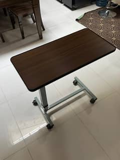 Nesting adjustable table